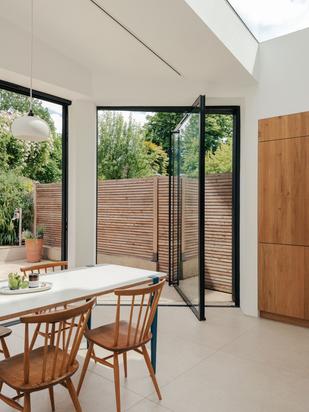 North London Victorian Villas | View of large pivot door leading to garden | Interior Designers